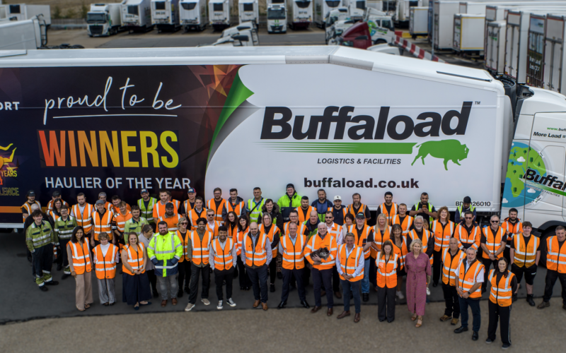 buffaload group/ colleagues standing next to buffaload motor transport awards trailer